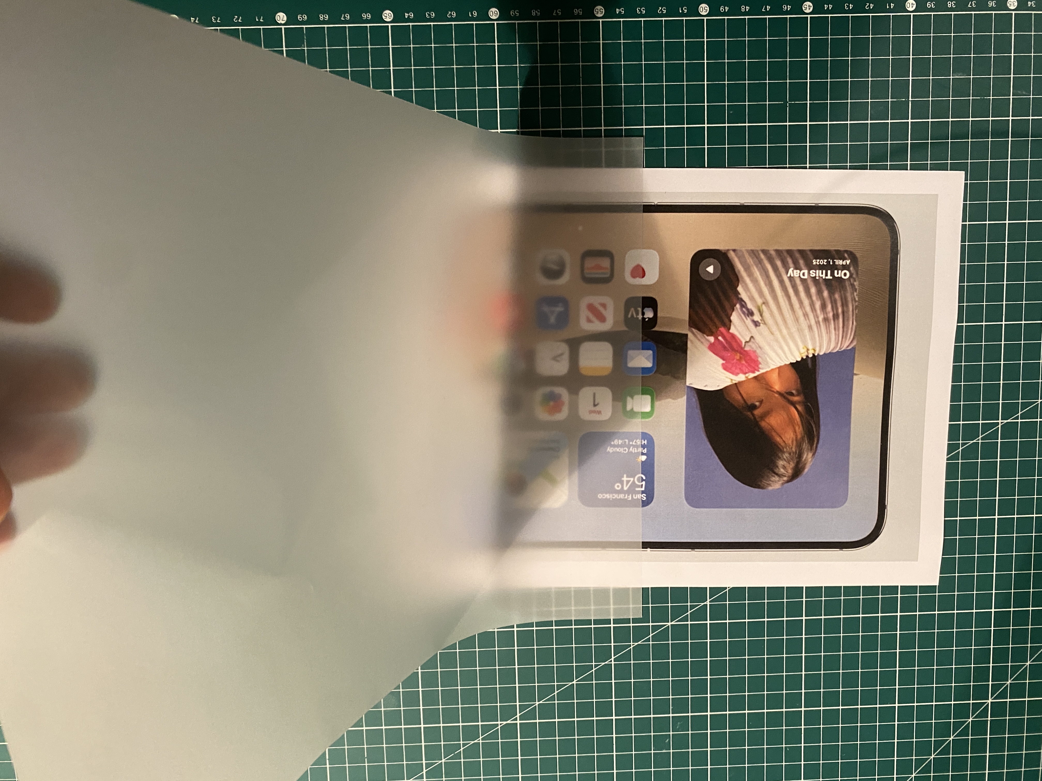 Tracing paper held above a lit table